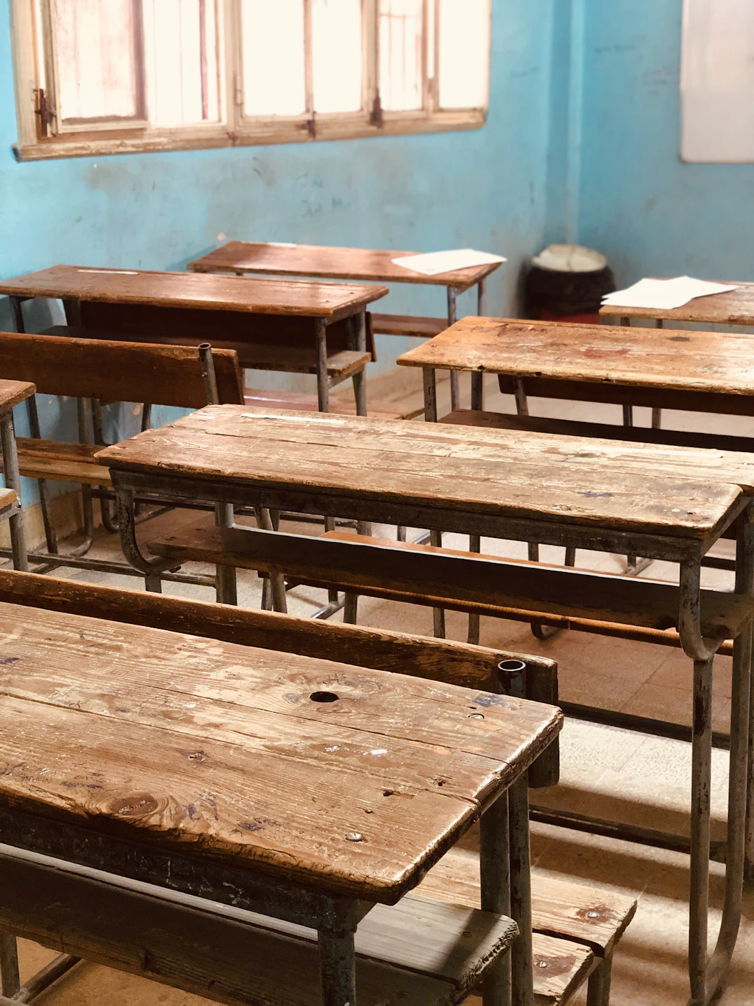 Neatly arranged school desks and accessible classroom storage
